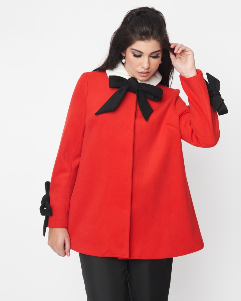 Front of a model wearing a size 2X Smak Parlour Red & Black Bows Topper Coat in Red & Black Bows by Smak Parlour. | dia_product_style_image_id:319969